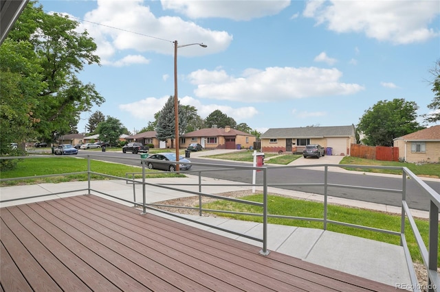 1436 S Yates St, Denver, CO 80219 - wooden terrace featuring a residential view and a yard