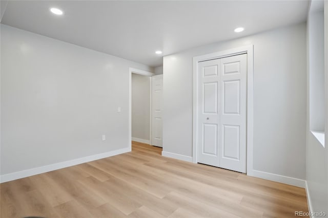 1436 S Yates St, Denver, CO 80219 - unfurnished bedroom with light wood-type flooring, recessed lighting, and a closet