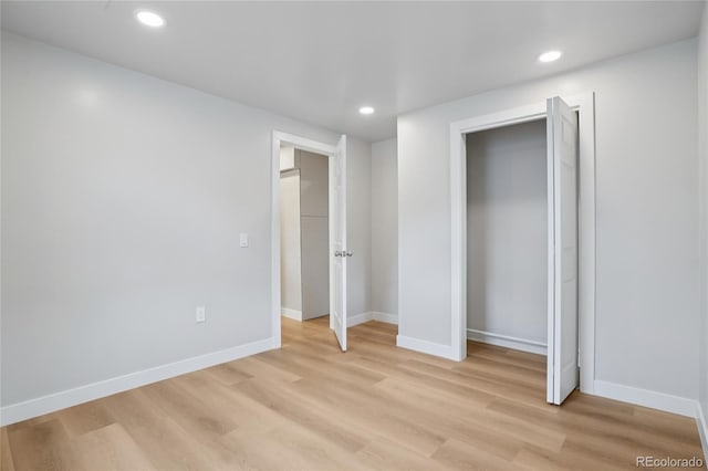 1436 S Yates St, Denver, CO 80219 - unfurnished bedroom featuring light wood-style flooring and recessed lighting
