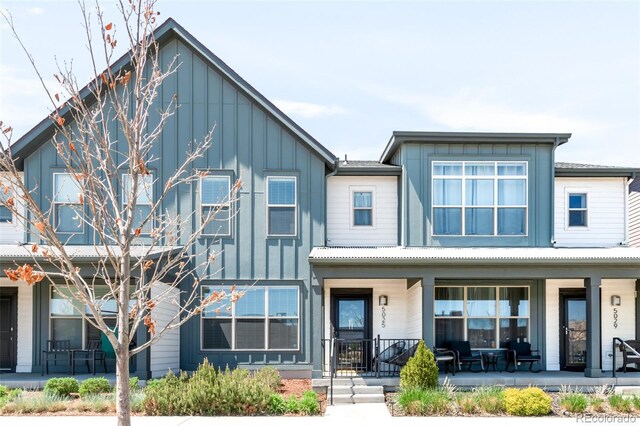5025 Central Park Blvd, Denver, CO 80238 - view of front facade featuring a porch and board and batten siding