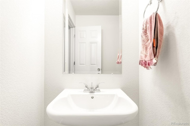 5025 Central Park Blvd, Denver, CO 80238 - bathroom with a sink and a textured wall