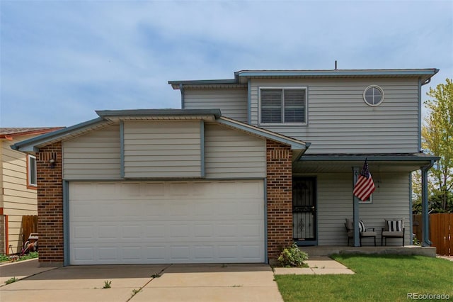 6119 Zenobia Ct, Arvada, CO 80003 - traditional home featuring covered porch, concrete driveway, a garage, and brick siding