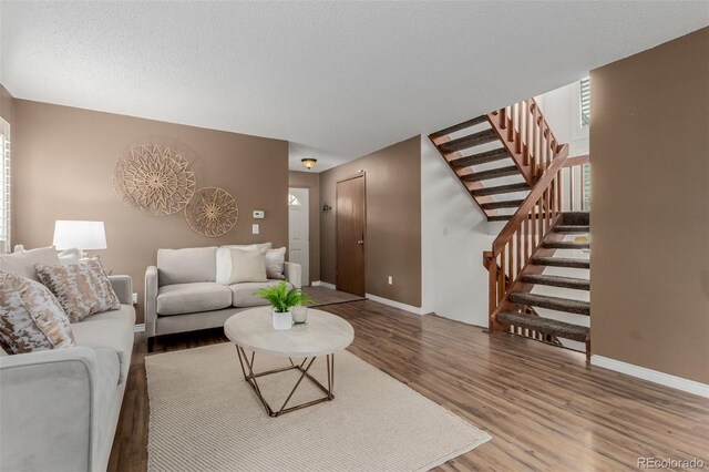 6119 Zenobia Ct, Arvada, CO 80003 - living room featuring wood finished floors and stairs