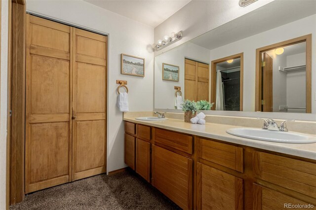6119 Zenobia Ct, Arvada, CO 80003 - full bathroom with a closet and double vanity