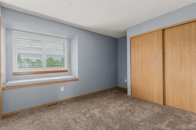 6119 Zenobia Ct, Arvada, CO 80003 - unfurnished bedroom with carpet floors, a closet, and a textured ceiling