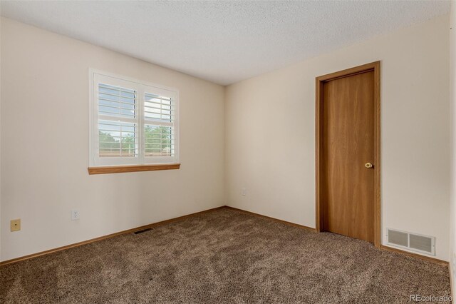 6119 Zenobia Ct, Arvada, CO 80003 - carpeted empty room featuring baseboards and a textured ceiling
