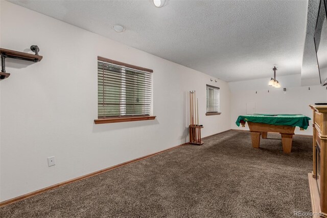 6119 Zenobia Ct, Arvada, CO 80003 - rec room with dark colored carpet, billiards, and a textured ceiling