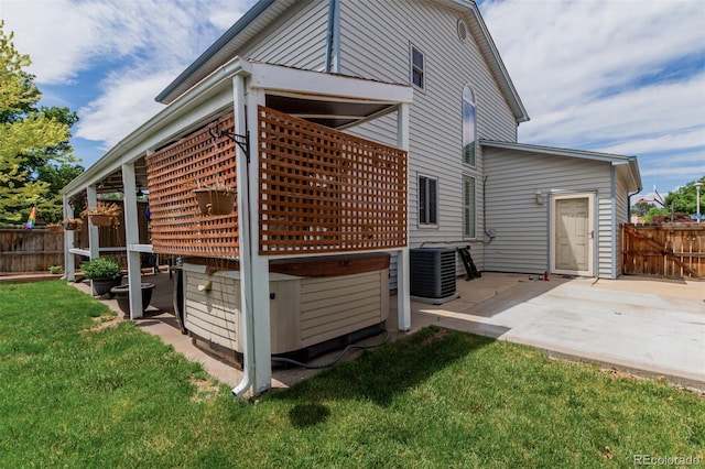 6119 Zenobia Ct, Arvada, CO 80003 - view of home's exterior with a patio and a hot tub