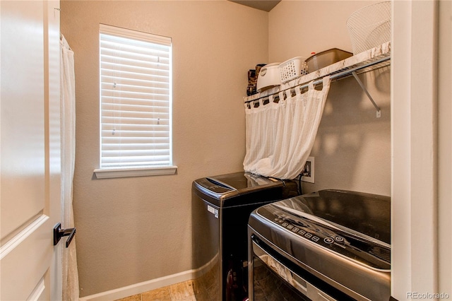 washroom with independent washer and dryer