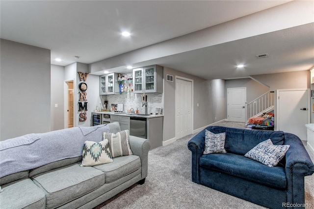 carpeted living room featuring indoor bar