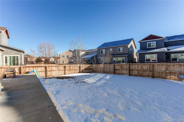 view of yard layered in snow