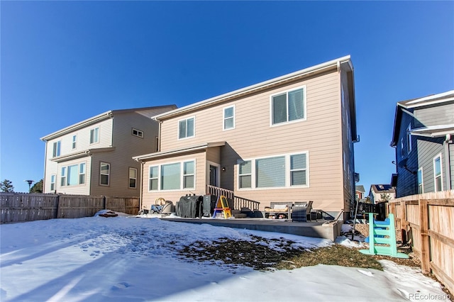 view of snow covered house