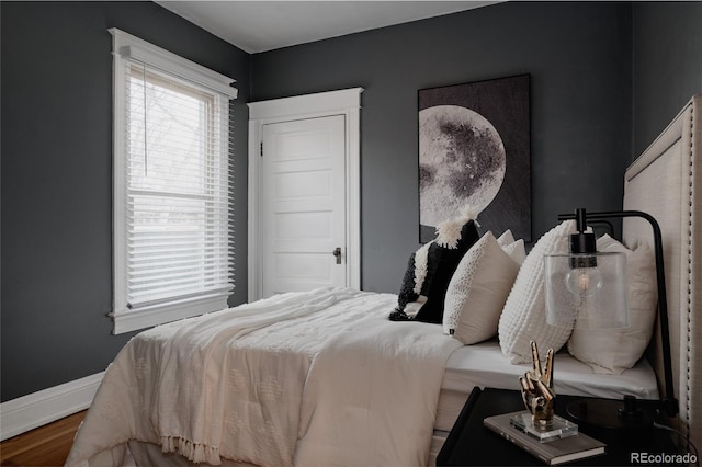 bedroom with hardwood / wood-style floors