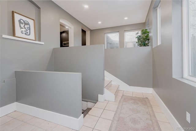 stairs with tile patterned floors