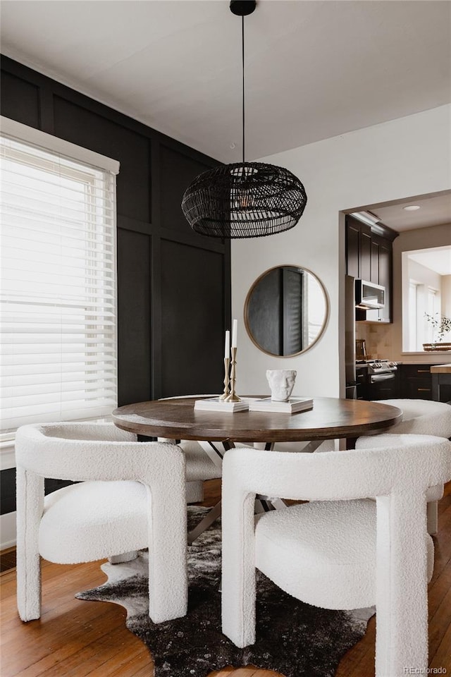 dining area featuring wood-type flooring