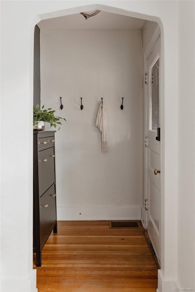 mudroom with wood-type flooring