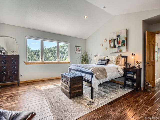 32663 Donna Dr, Conifer, CO 80433 - bedroom featuring wood-type flooring, vaulted ceiling, and recessed lighting