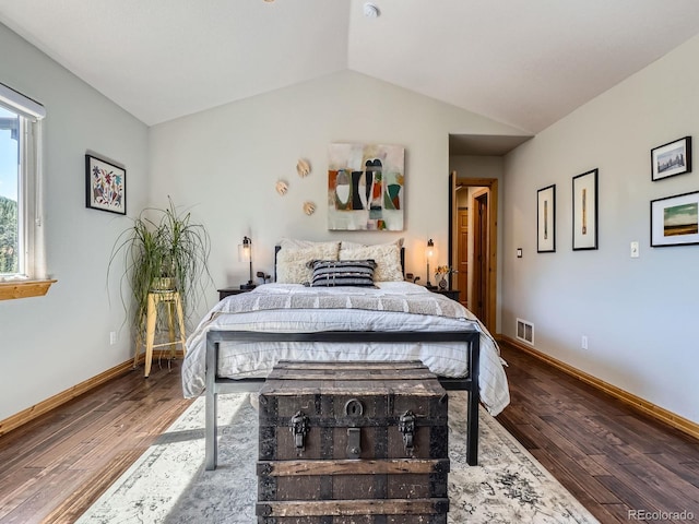 32663 Donna Dr, Conifer, CO 80433 - bedroom featuring wood finished floors and vaulted ceiling