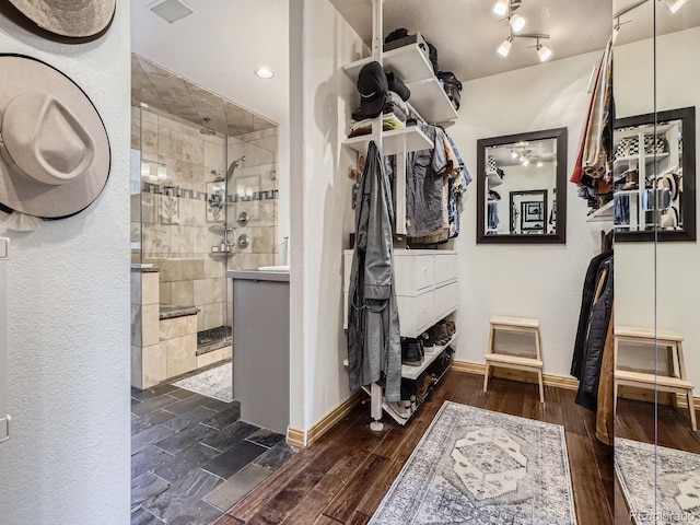 32663 Donna Dr, Conifer, CO 80433 - spacious closet featuring dark wood-style floors