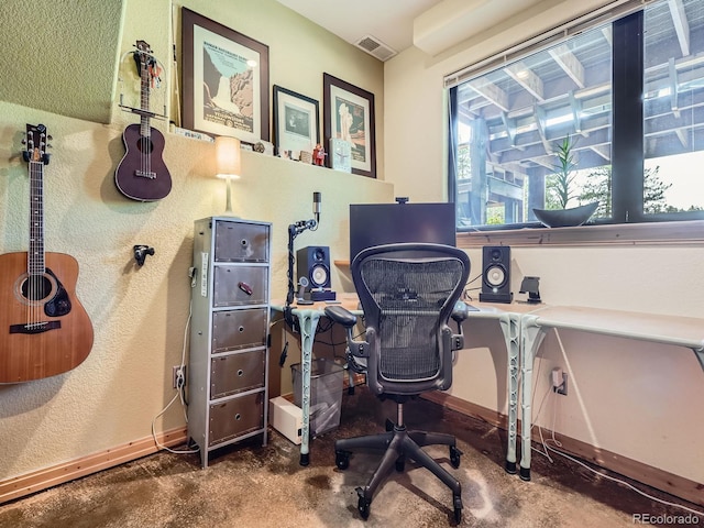 32663 Donna Dr, Conifer, CO 80433 - office featuring finished concrete flooring and a textured wall