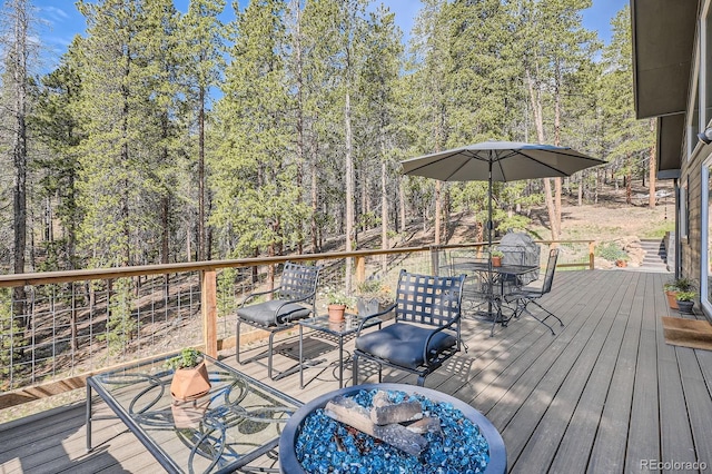 32663 Donna Dr, Conifer, CO 80433 - deck featuring outdoor dining area