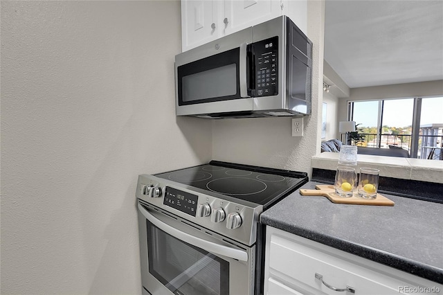 kitchen featuring white cabinets and stainless steel appliances