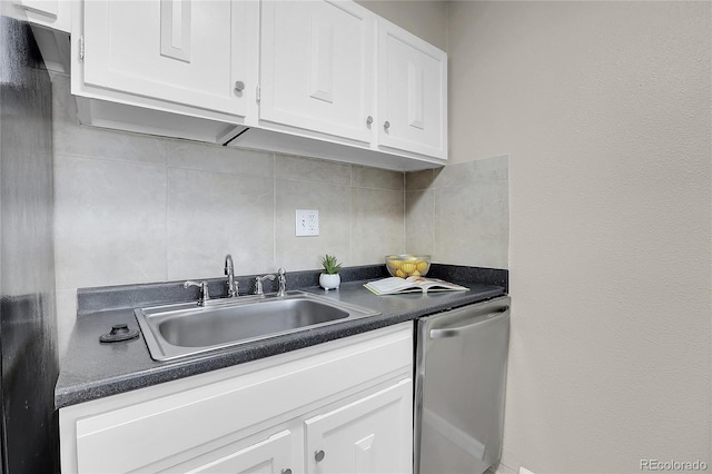 kitchen with backsplash, dishwasher, white cabinetry, and sink