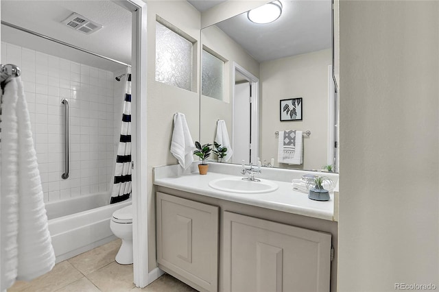 full bathroom with toilet, shower / tub combo, vanity, and tile patterned floors