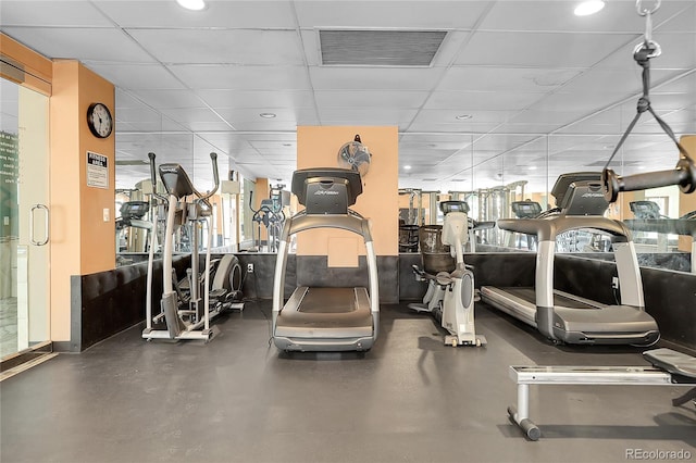 gym featuring a paneled ceiling