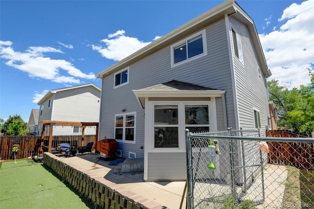 3769 Dahlia St, Denver, CO 80207 - back of house with a gate, a patio area, an area to practice putting, and a shingled roof