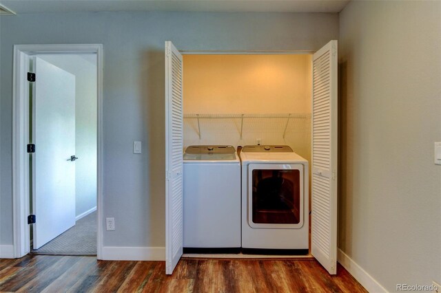 3769 Dahlia St, Denver, CO 80207 - laundry area featuring washer and dryer, dark wood-style flooring, and baseboards