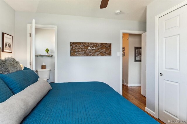 bedroom with ceiling fan, baseboards, and wood finished floors