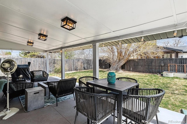 view of patio / terrace featuring a fenced backyard, outdoor dining space, and outdoor lounge area