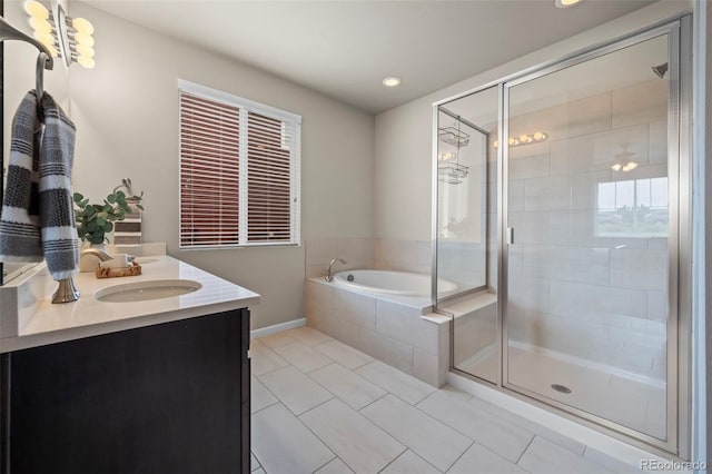 1677 Meagan Way, Erie, CO 80516 - bathroom with double vanity, a garden tub, tile patterned flooring, a shower stall, and recessed lighting