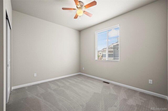 1677 Meagan Way, Erie, CO 80516 - unfurnished bedroom with carpet, baseboards, and a ceiling fan