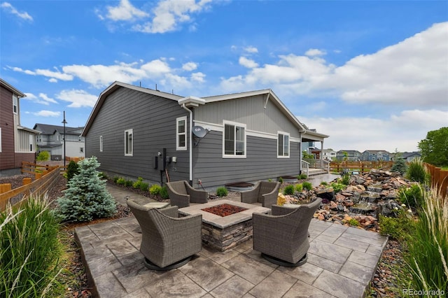 1677 Meagan Way, Erie, CO 80516 - view of patio with a fire pit and a residential view