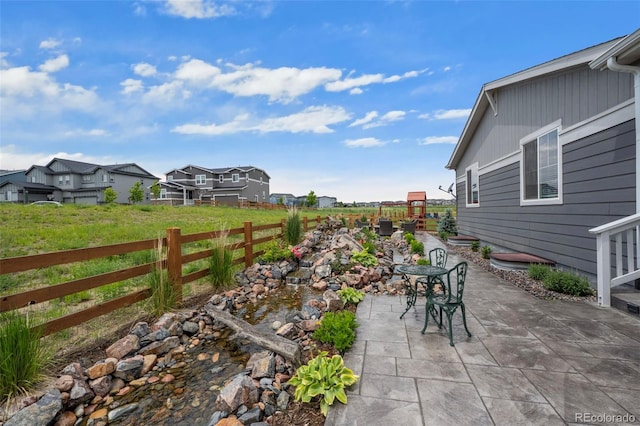 1677 Meagan Way, Erie, CO 80516 - view of patio featuring a residential view