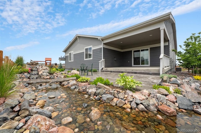 1677 Meagan Way, Erie, CO 80516 - back of house with a patio