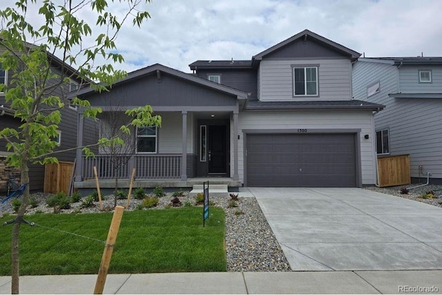 1300 Loraine Cir N, Lafayette, CO 80026 - view of front of property featuring covered porch, concrete driveway, a front lawn, and a garage