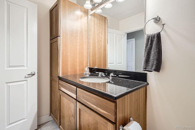 1950 N Logan St Unit 108, Denver, CO 80203 - bathroom with vanity and tile patterned flooring