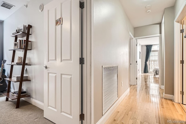 1950 N Logan St Unit 108, Denver, CO 80203 - corridor featuring light wood-style flooring and baseboards