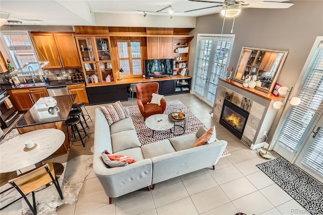 1950 N Logan St Unit 108, Denver, CO 80203 - living area featuring rail lighting, a ceiling fan, and light tile patterned floors