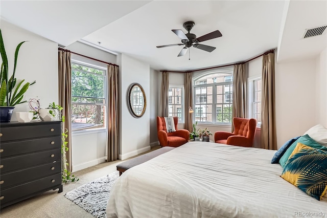 1950 N Logan St Unit 108, Denver, CO 80203 - carpeted bedroom with baseboards and a ceiling fan