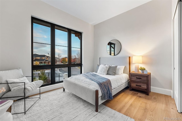 bedroom with light hardwood / wood-style flooring