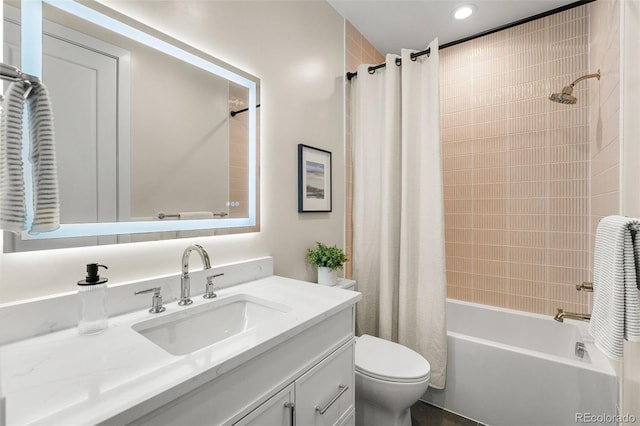 full bathroom featuring shower / bathtub combination with curtain, vanity, and toilet