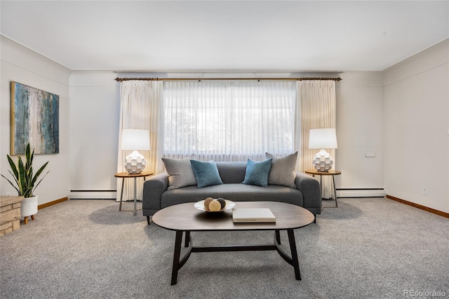 living area with a baseboard radiator, a baseboard heating unit, carpet, and baseboards
