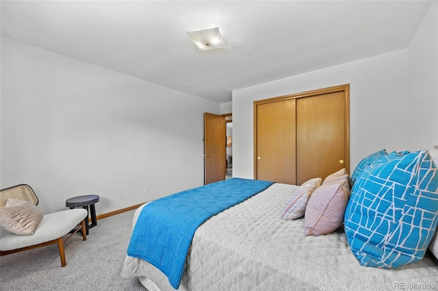 bedroom featuring carpet flooring, a closet, and baseboards