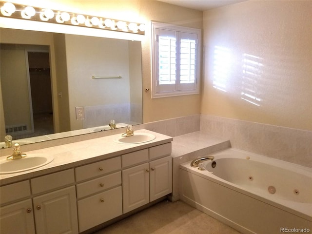 bathroom featuring vanity and a tub