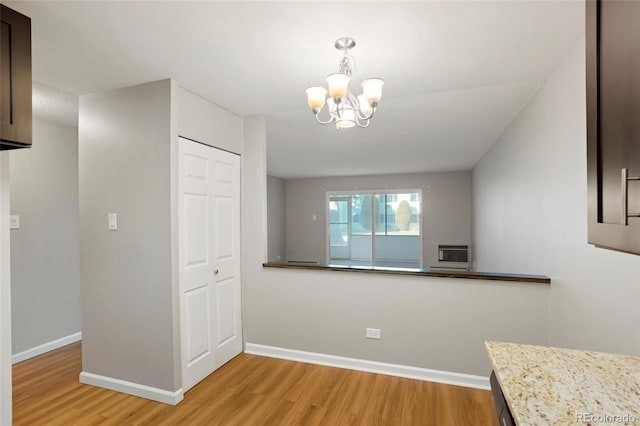 interior space with light hardwood / wood-style flooring and a notable chandelier