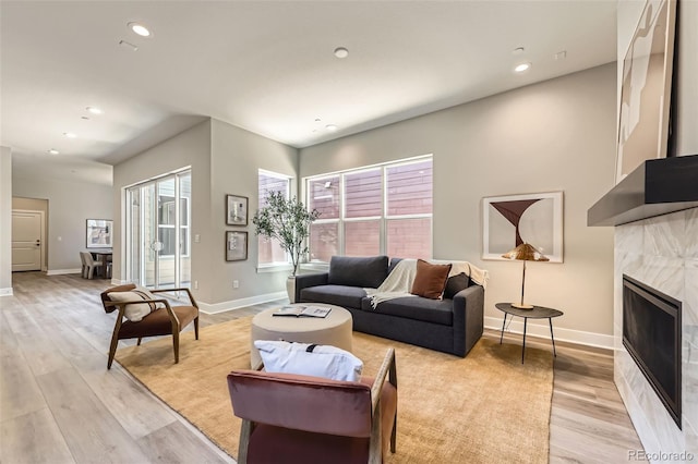 858 Promenade Dr, Superior, CO 80027 - living area with baseboards, light wood-style flooring, recessed lighting, and a premium fireplace
